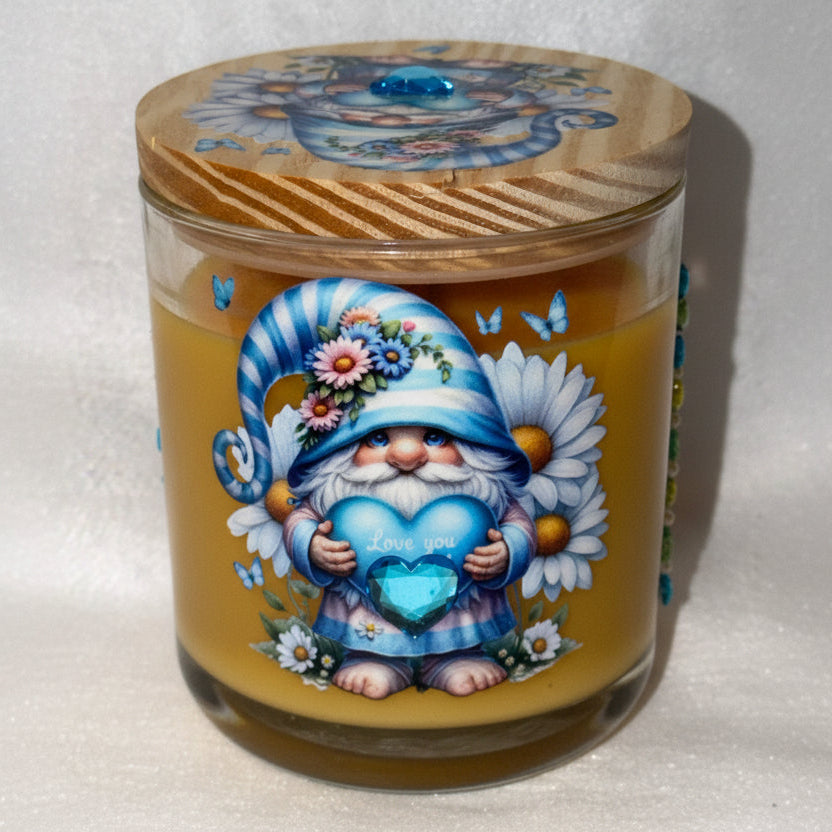 Decorative container with a painted design of a gnome on a white background