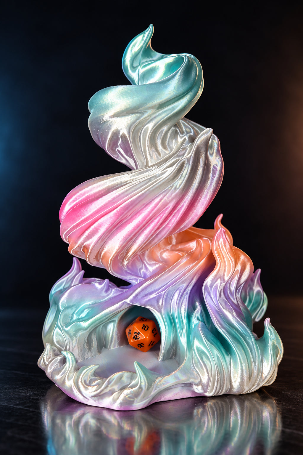 A 3D-printed iridescent flame-shaped figurine with a holographic finish shifting between pink, blue, purple, and white, featuring a small orange die nestled in its base, set against a dark reflective background.