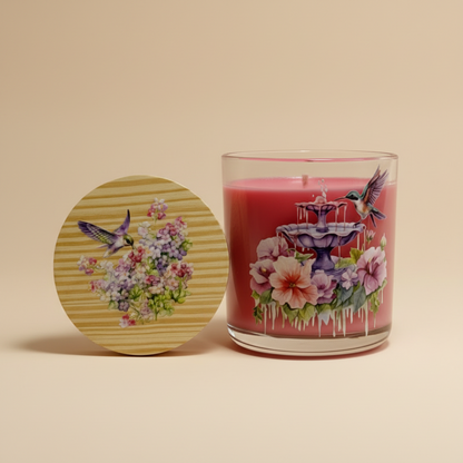 Candle with decorative cover featuring floral and bird design on a white background