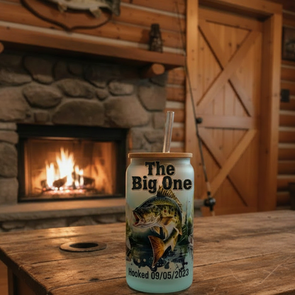 Can of 'The Big One' beer on a wooden table with a fireplace in the background