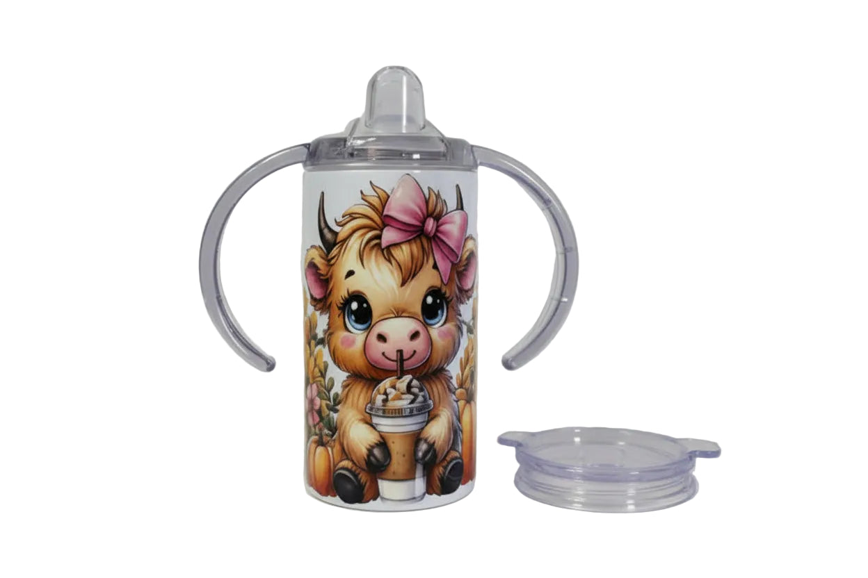 Tumbler with a cartoon cow design on a white background