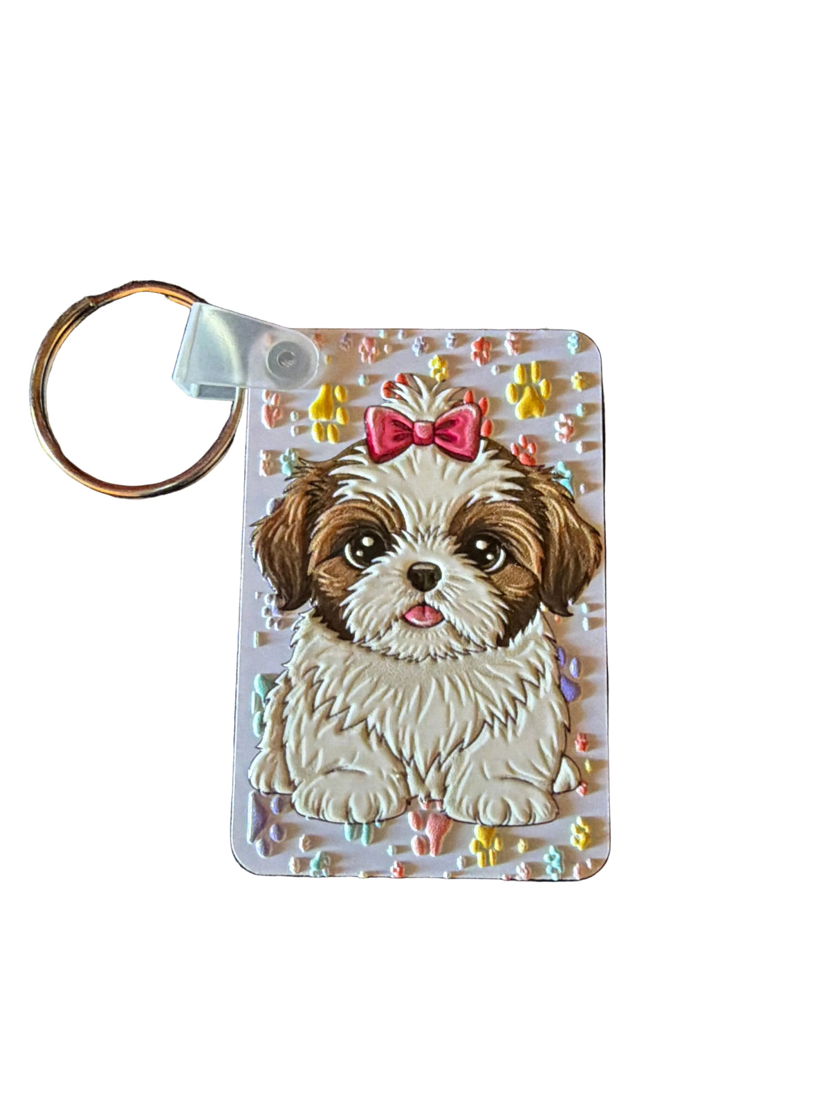 Shih Tzu dog key tag with a pink bow and colorful paw-print background