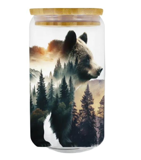 Glass jar with a bear and forest design on a white background