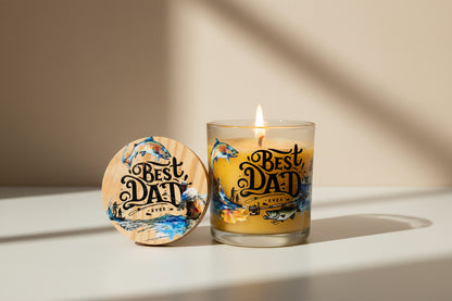 Candle with 'Best Dad Ever' text and wooden coaster on a white background