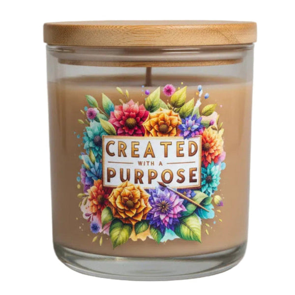 Candle with floral design and 'Created with a Purpose' text on a white background