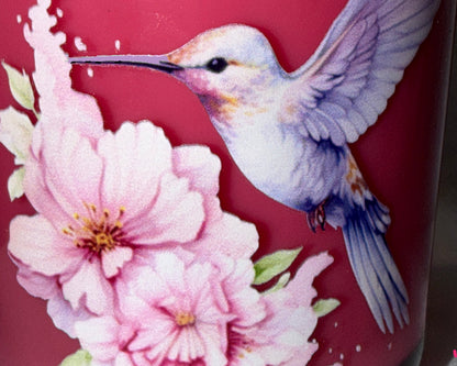 Decorative item with a bird and flowers on a red background