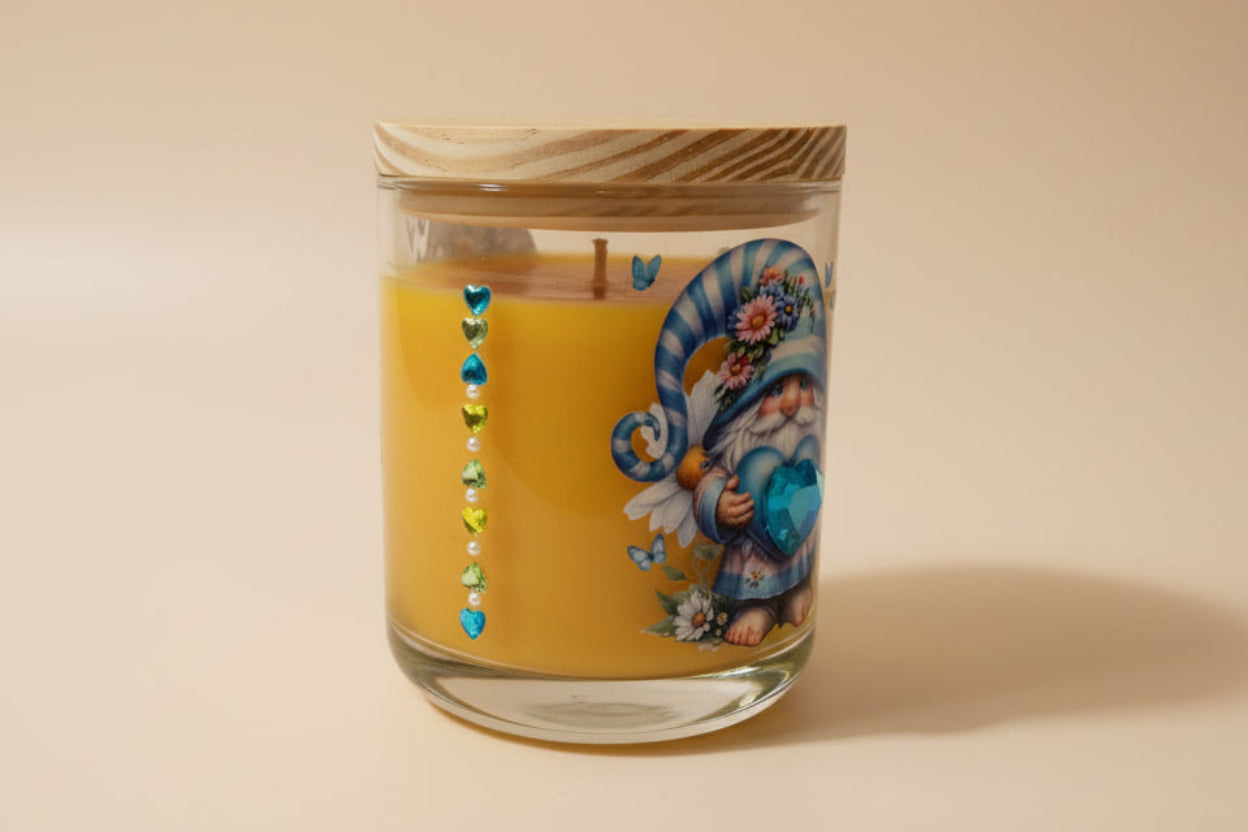 Decorative candle in a glass jar with a wooden lid on a beige background