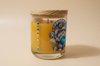 Decorative candle in a glass jar with a wooden lid on a beige background